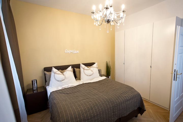 spacious bedroom with a 200x180 boxspring bed 