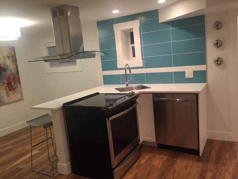 Full Kitchen with stove - dishwasher - fridge - microwave - toaster - kettle.