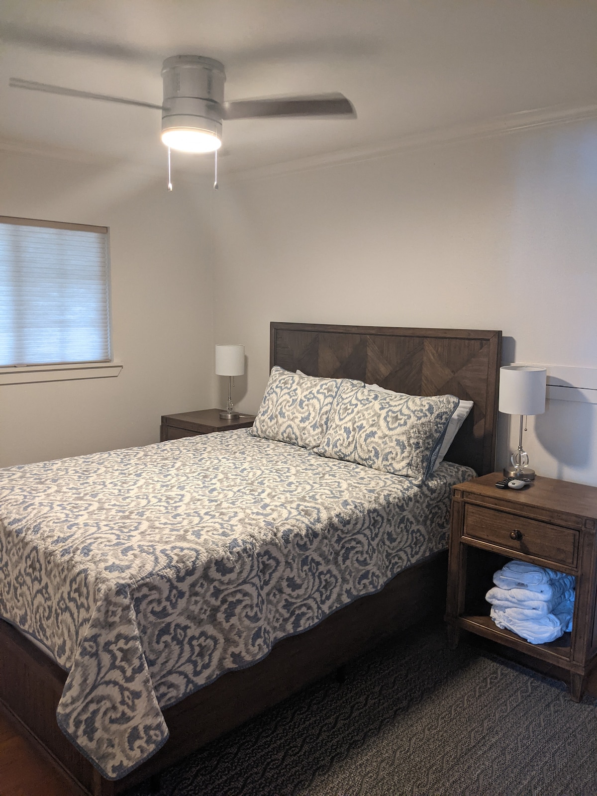 Cozy Retreat: Retreat to the comfort of our downstairs Queen bedroom, complete with a Smart TV and attached bathroom for added convenience.