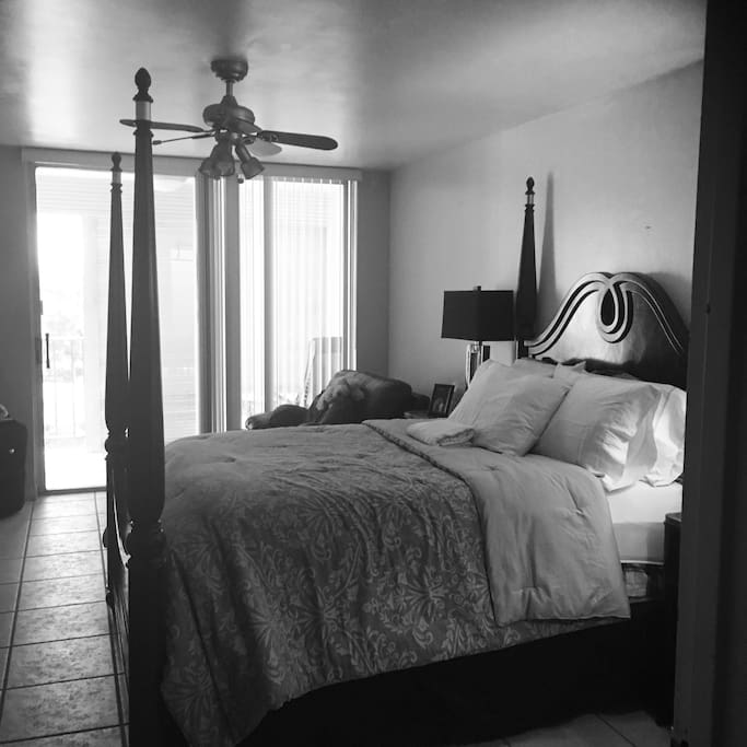 Queen bed, one bedroom with balcony facing Three Islands Blvd.