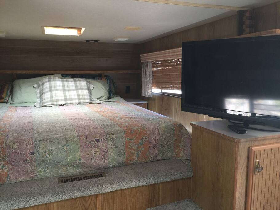 Swivel TV can be watched from bed or the living room