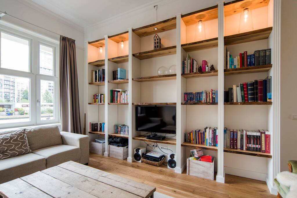 Other side living room; see how light.
Modern bookcase with "built in" flat screen.