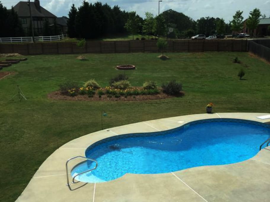 Custom pool with new furniture and toys to enjoy when it's warm.