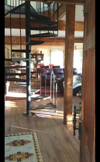 From front door through spiral iron staircase