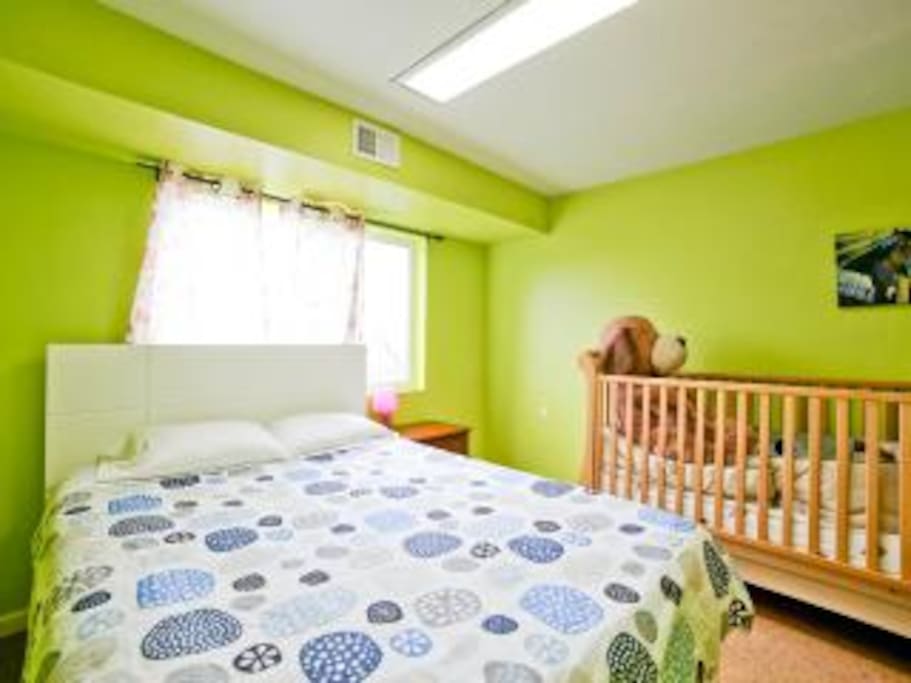 crib + queen bed (bedroom 2)