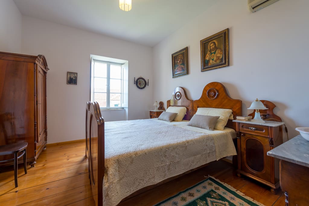 Master bedroom with king bed and antique furniture