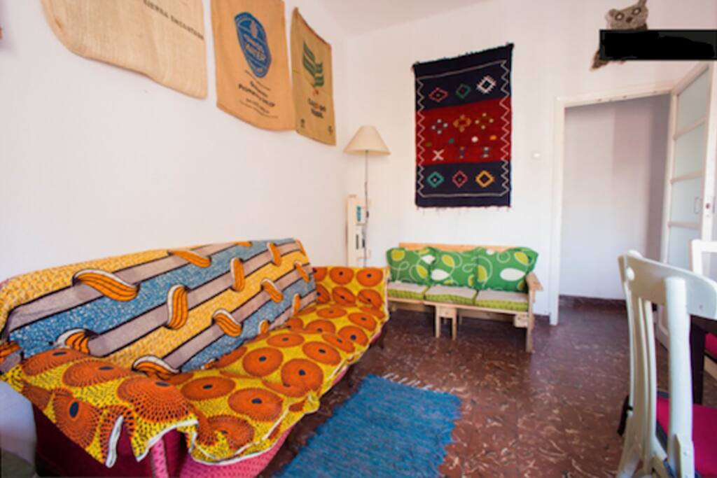 This is the lounge within the flat. Most everything in it, is made up of either handmade or recycled materials, besides the mattresses, cushions and beddings which are bought brand new. The lounge is specious enough to have a dinner for 6 people and to relax after a long day out in Valencia. There's a large window for great light and fresh air. The lounge is situated right next to the kitchen where it has easy access to it. Inside the lounge is where you'll find the wireless router for the internet connection.