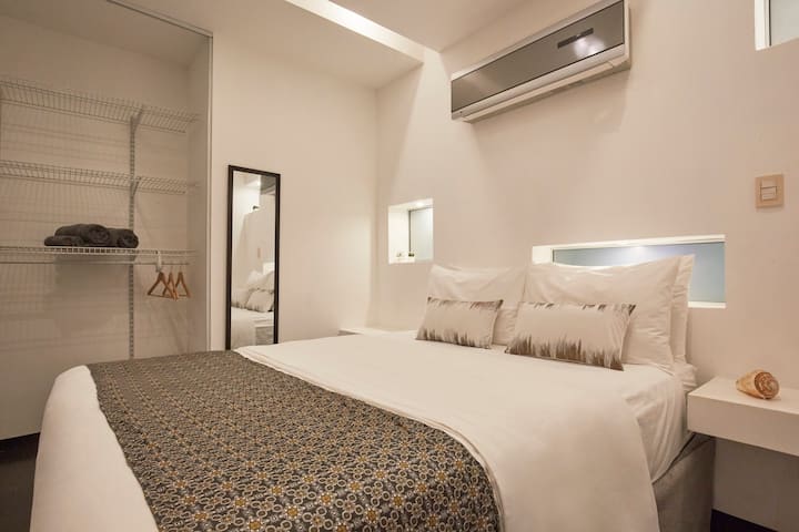 Master Bedroom with Queen size bed, Ac and private bath.