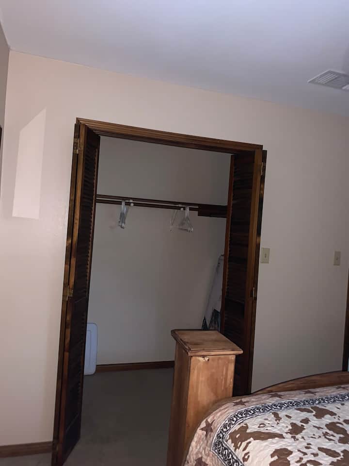 Large Bedroom closet with hangers
