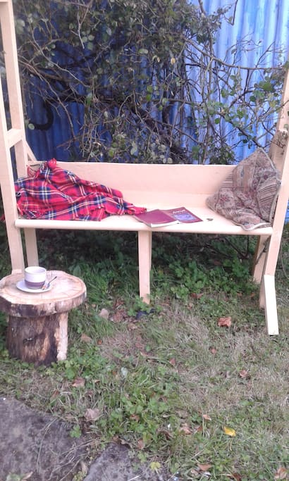 Tea chair by the rosebush