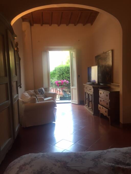 large bedroom with sitting room and TV Lovely view from bed