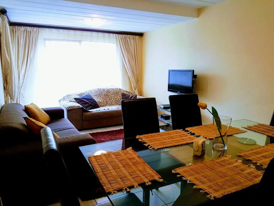Lounge and dinning area. Tv and Decoder.