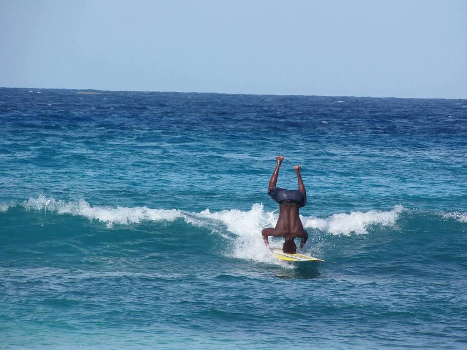 Surfer showing off his skills on the surfing board
