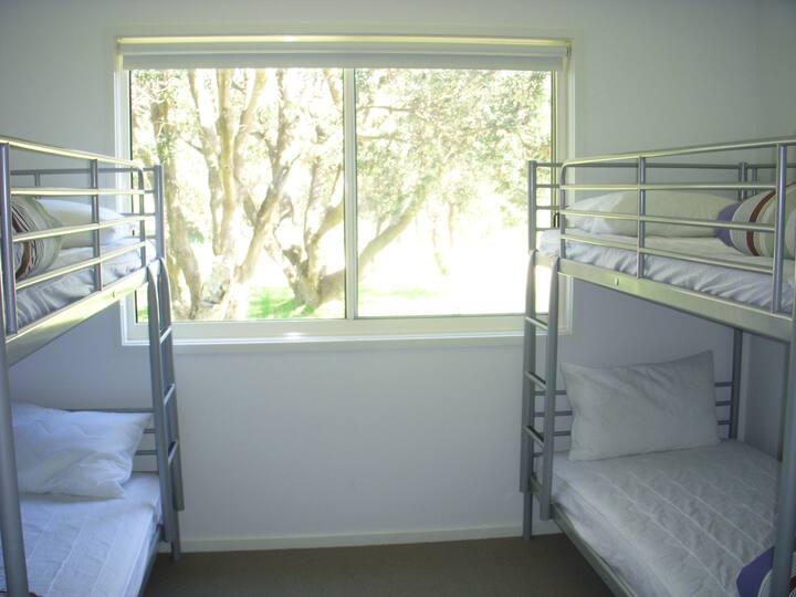 Third bedroom has bunk beds.