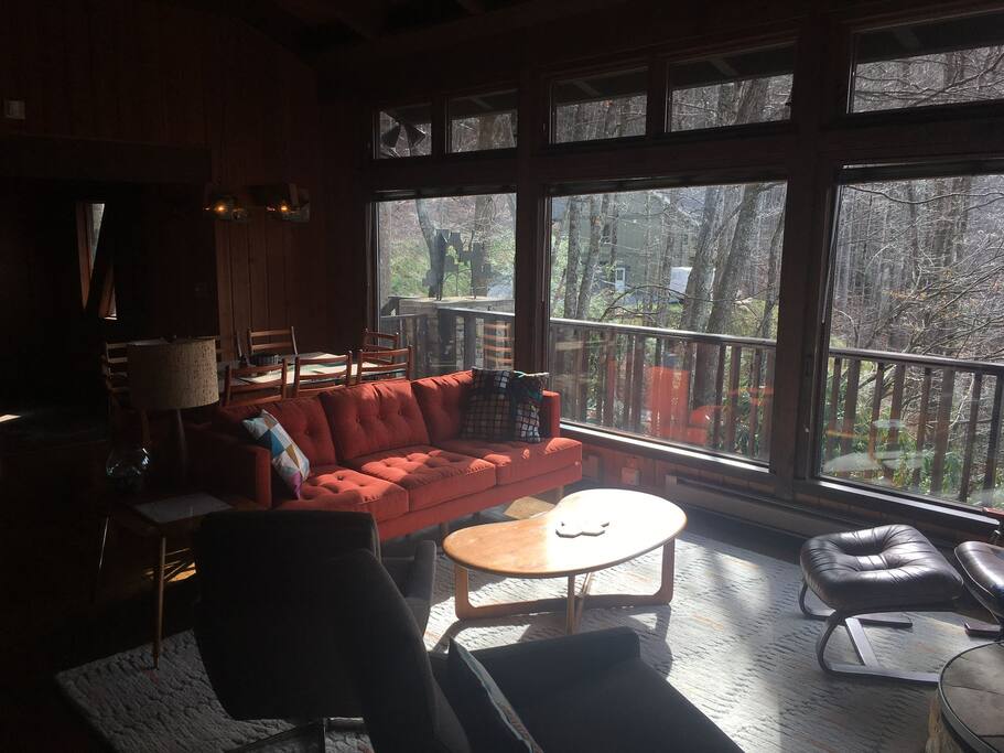 Large expansive windows showcase beautiful views of the outdoors.