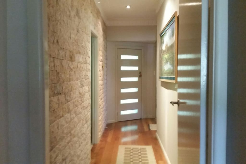Beautiful guest entrance with stone tiles