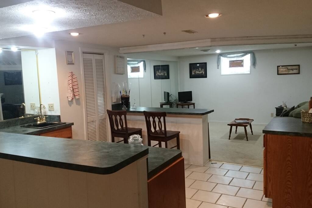 Kitchen has a breakfast bar.