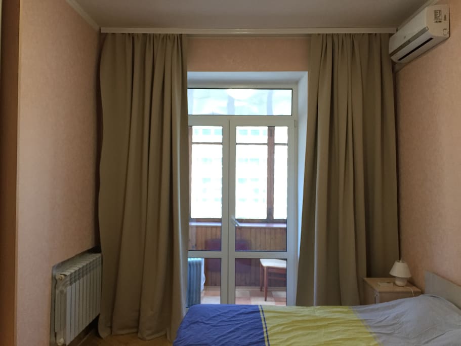 New queen-size mattress; air conditioner: black-out curtains: dresser: large closet; two night stands; large balcony.