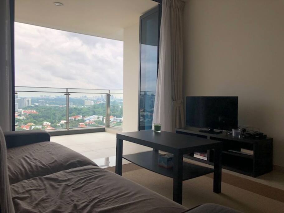 Living room - comfy sofa and tv and balcony over looking the view