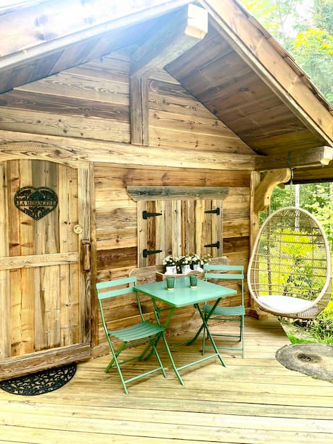 A small house with its covered Jacuzzi