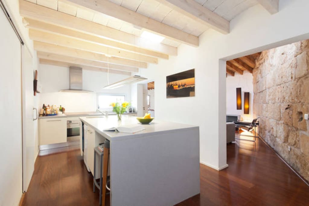 The kitchen, with coffee machine, dishwasher, washing machine, dryer etc...