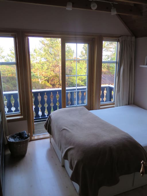 Bedroom 1, double-bed with balcony and view of the fjord