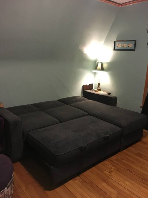 The couch converts to a King bed, with new linens under the chaise.