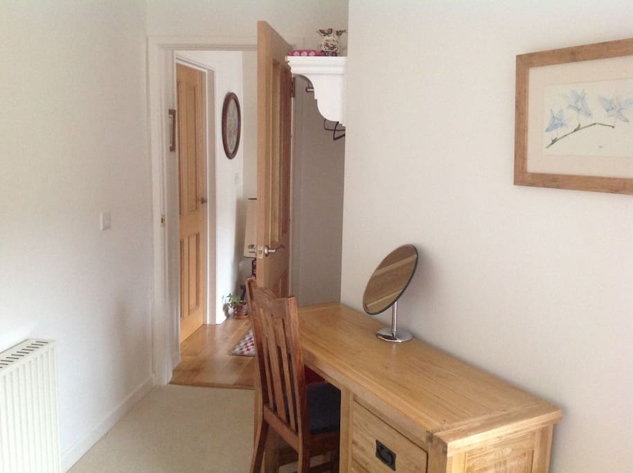 A dressing table and tea making facilities.