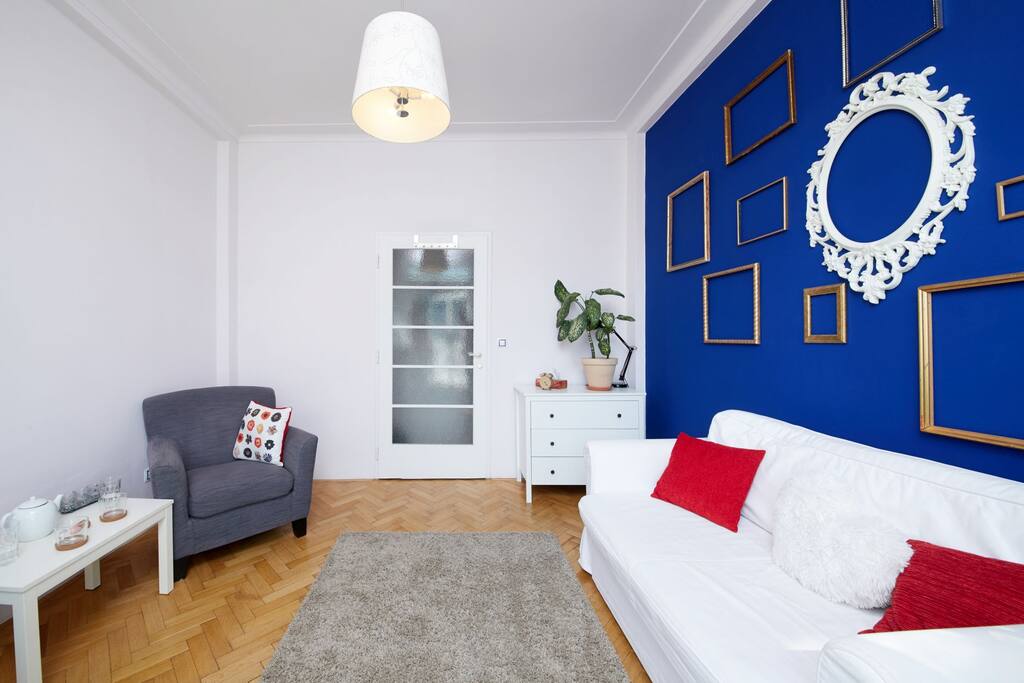 The room is light, warm, full of plants, and very cosy.