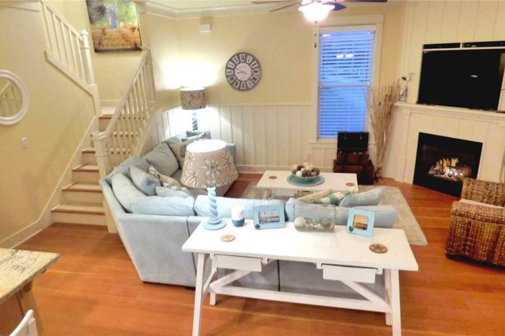 Spacious living room with a gas fireplace and flat screen TV