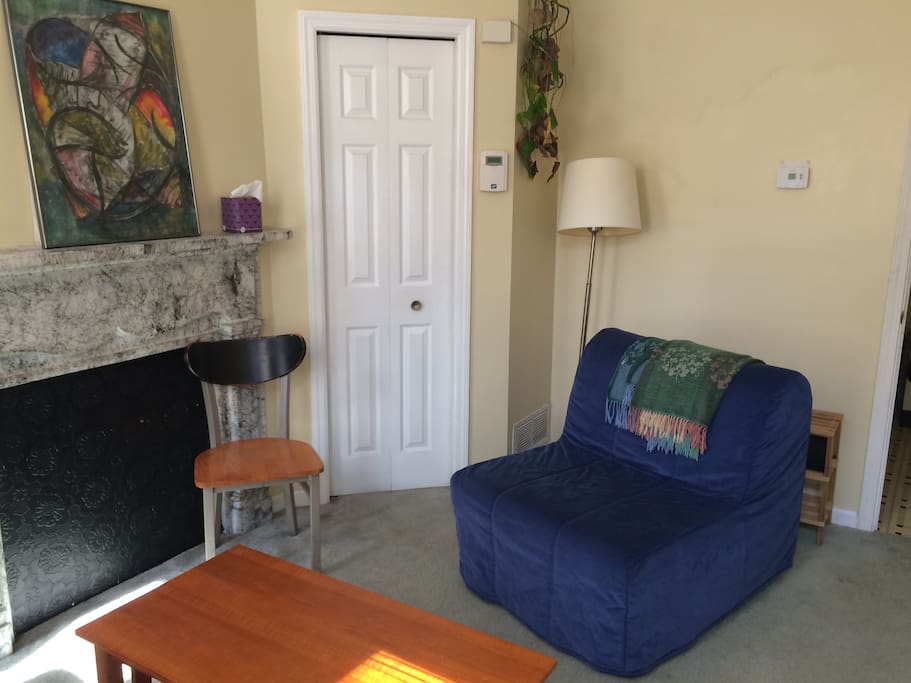 Shared living room on the first floor. Extra everything (sheets, blankets, pillows, paper towels, etc) are in the closet.