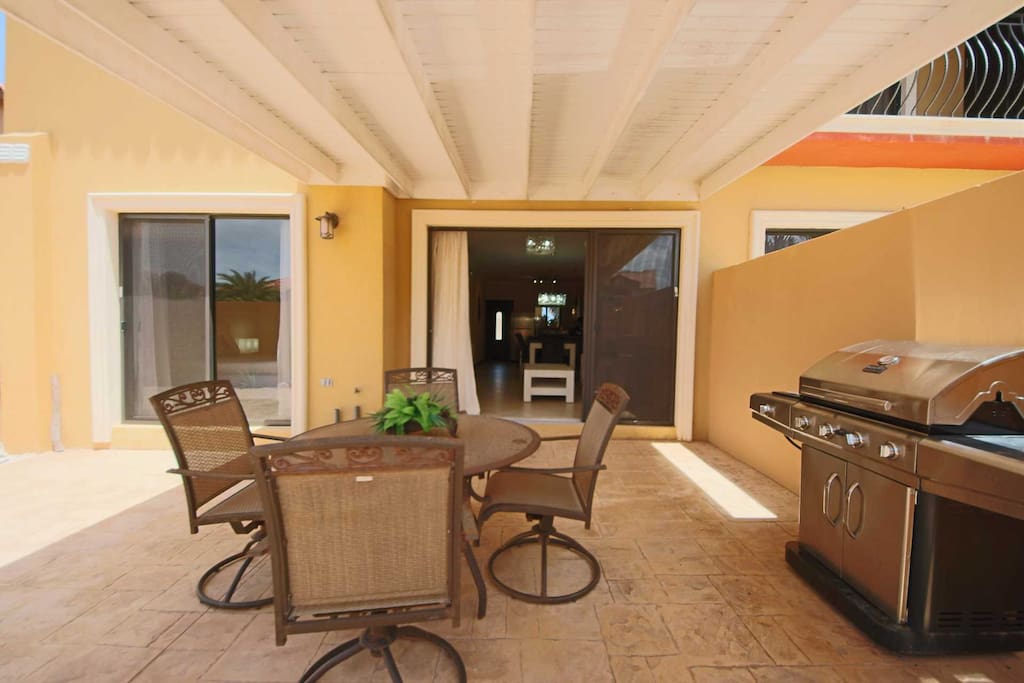 The veranda with a BBQ-grill and 4-seat dining table