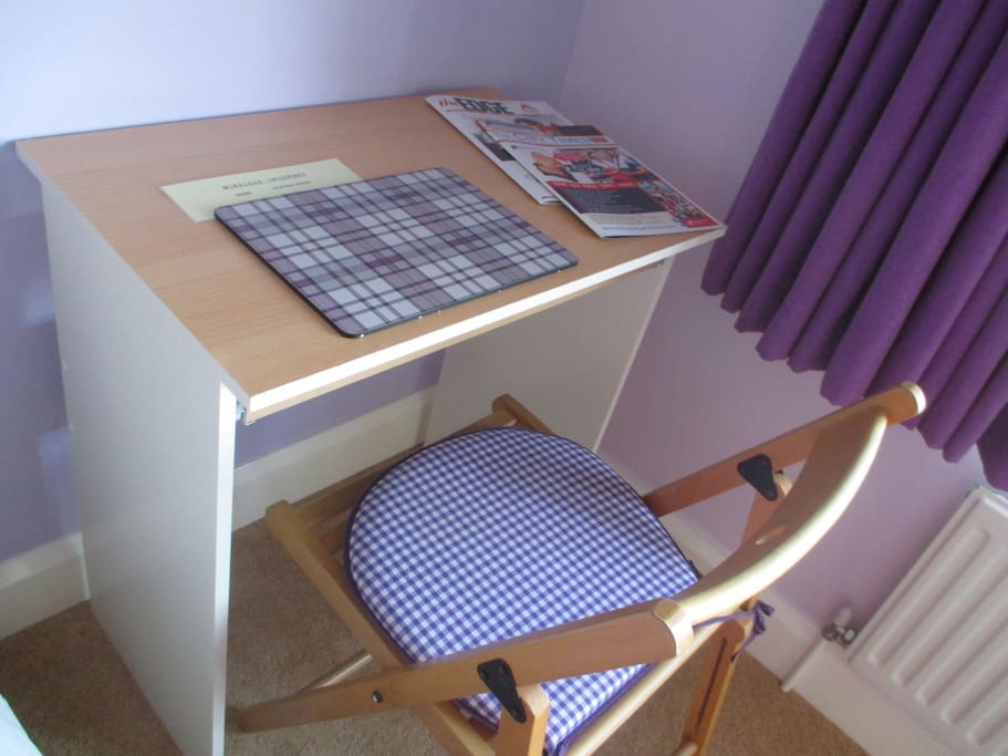 Laptop friendly workspace in the room.