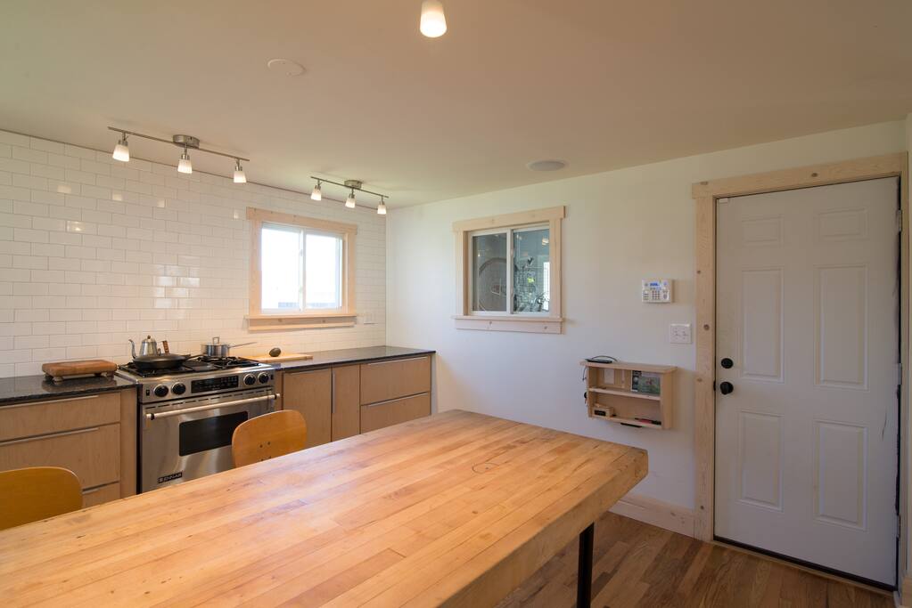 To the left-hand side of the door is a nook for keys, taking a note and USB outlets for charging your devices. There is a hookup for audio to play music through ceiling-mounted speakers.