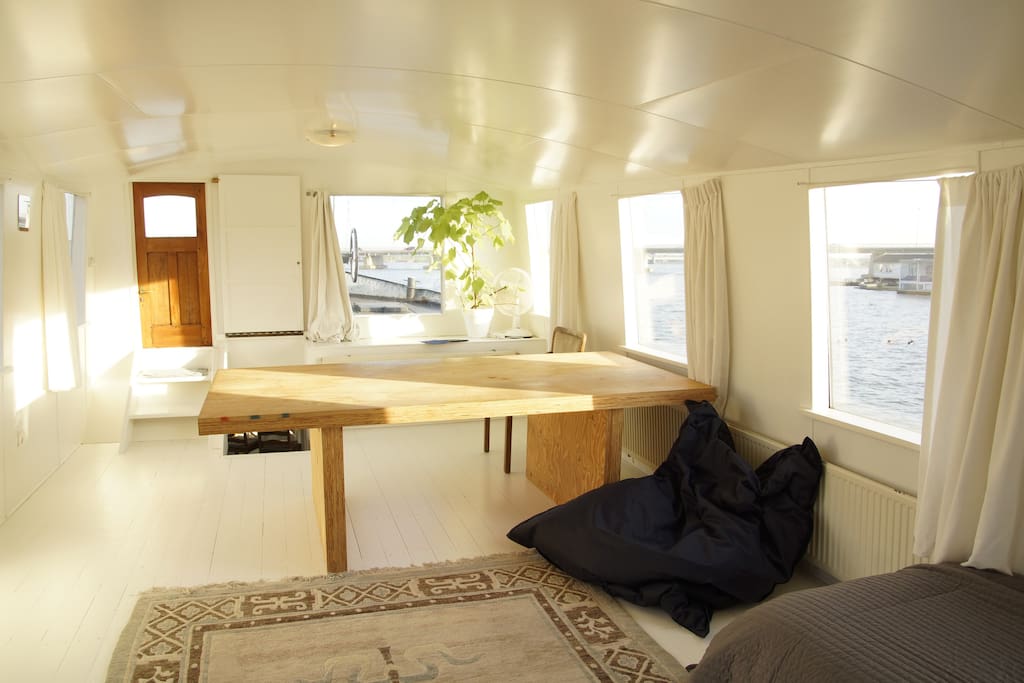 Bedroom in the top floor of the boat with amazing views of the lake, birds and sun.
