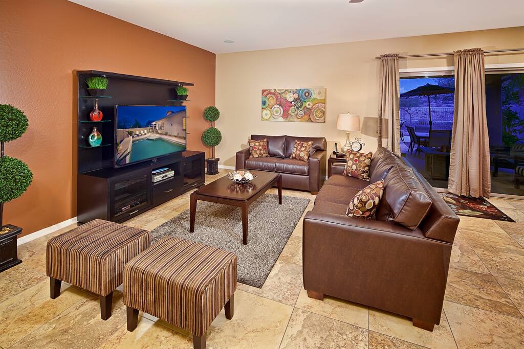 Spacious living room with huge HD TV and plenty of seating!