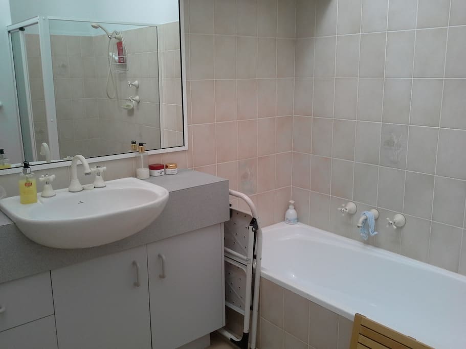 Shared Bathroom with bath and shower