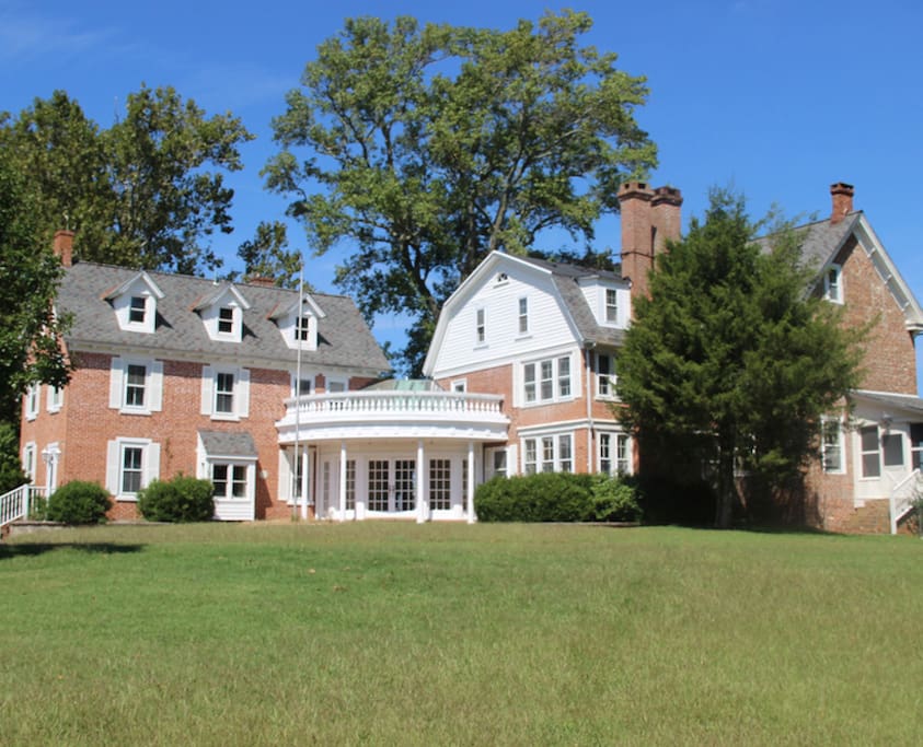 This is the view of the historic 10 bedroom mansion from the lawn. The 5200 sq. ft. hose with 6 fireplaces and 8 bathrooms has ample room for the largest of parties.