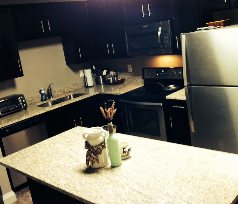 The kitchen is fully stocked with utensils, baking ware, spices, oil and any appliances you might need.