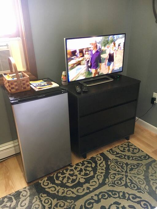 Private bedroom comes equipped with mini fridge, high definition tv.