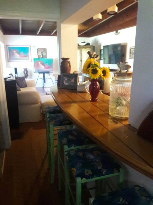 breakfast nook/counter made of a surfboard. with stools