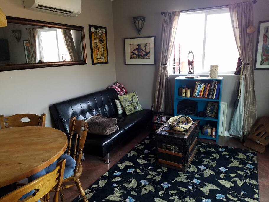 Living room decorated in African style with futon couch