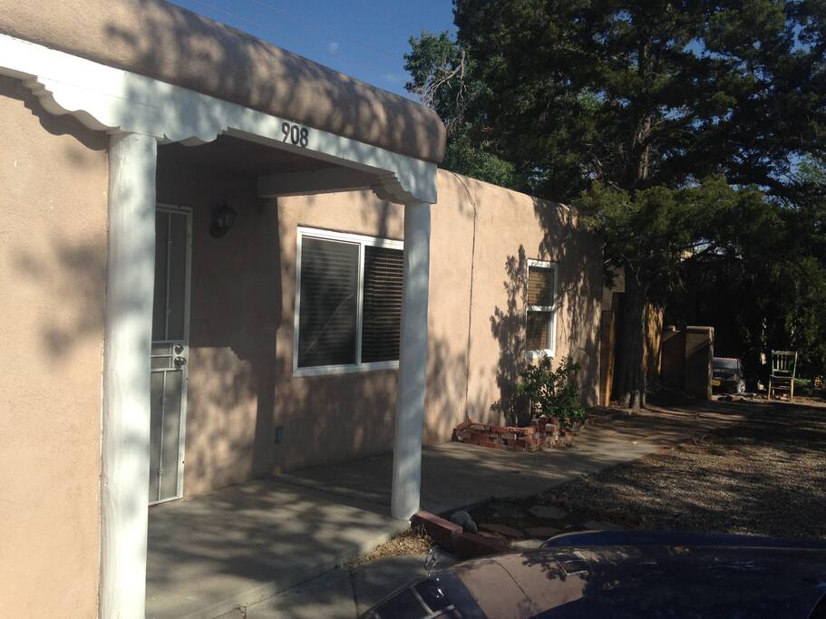 Shaded adobe home. Classic New Mexico.