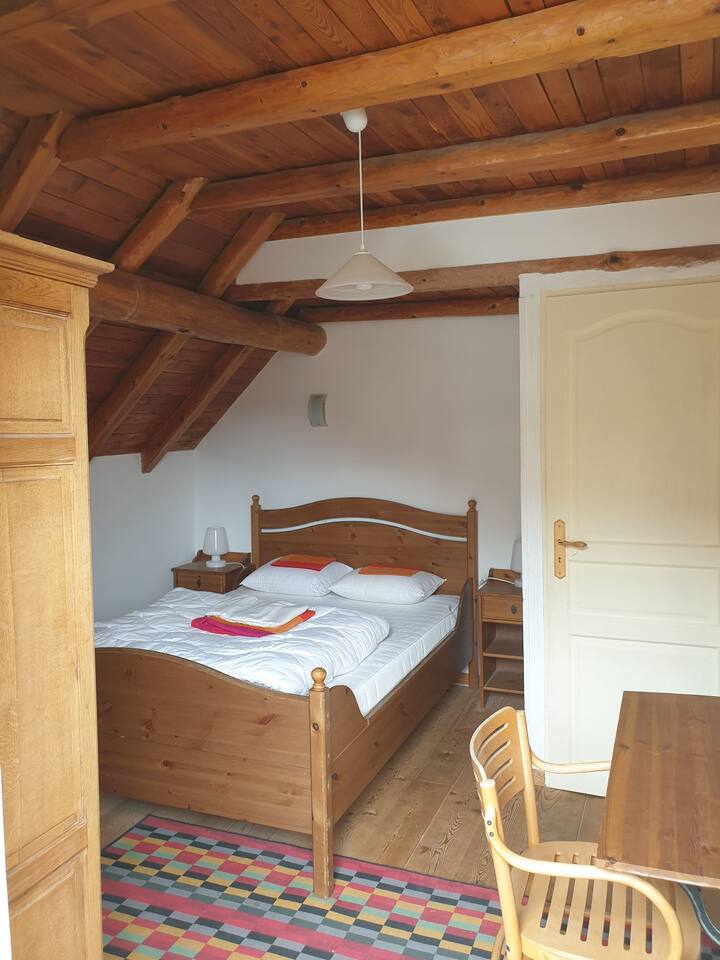 Yellow room with window door on balcony. The wardrobe is available for your clothes.