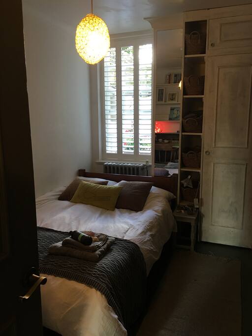Bed backing onto secluded courtyard