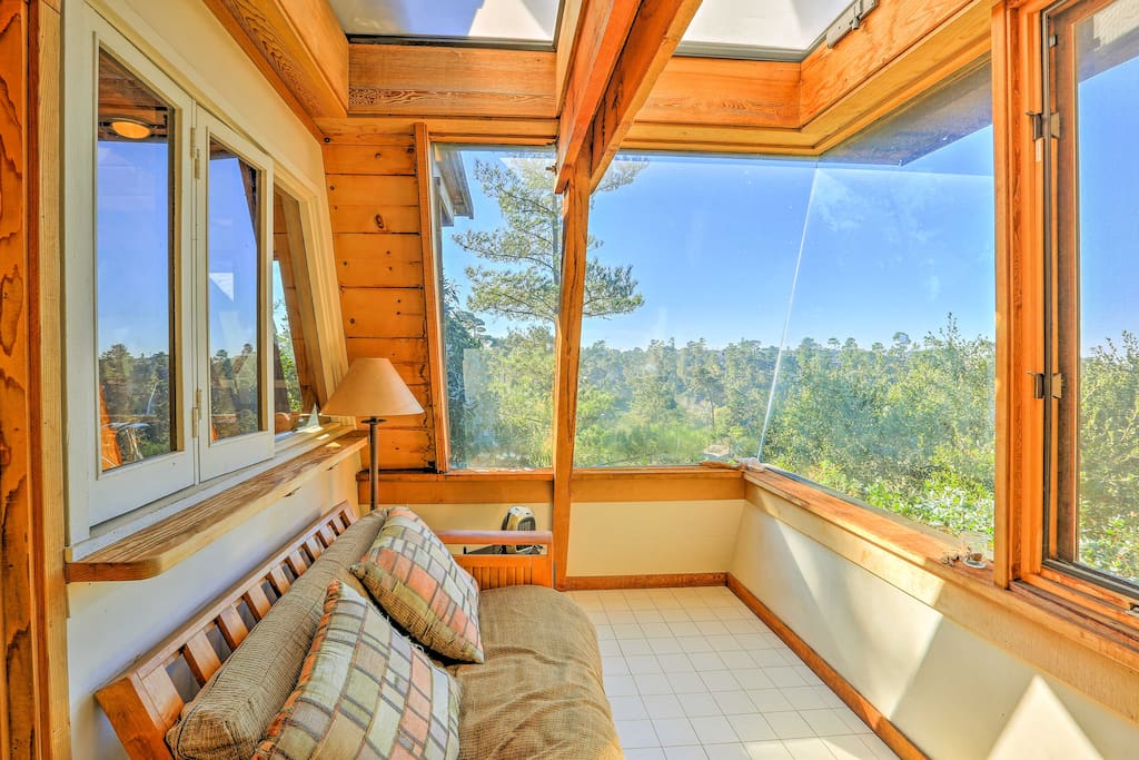 When you're not soaking in the views from the hot tub, admire them from behind the glass in this serene sun room.