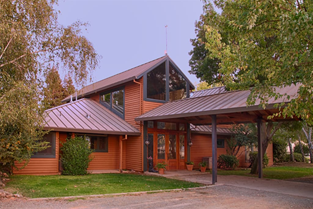 Entrance to home protected by covered breezeway.