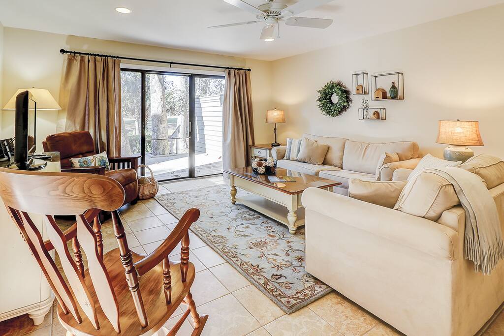 Sliding glass doors in the living room lead out to the back deck.