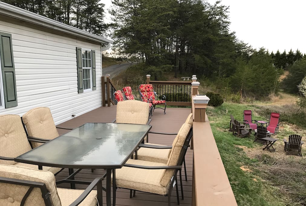 Front deck and yard offer plenty of seating and scenery.