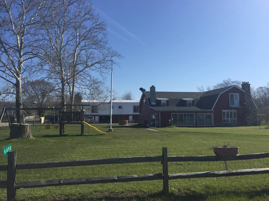 Homeowner lives in the house in the front. Apartment is in the upstairs of the building in the back. The property has been affectionately known for decades as "Bodie's Barn."